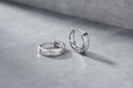9ct White Gold 12mm Princess Cut CZ Huggie Earrings on steel grey textured background