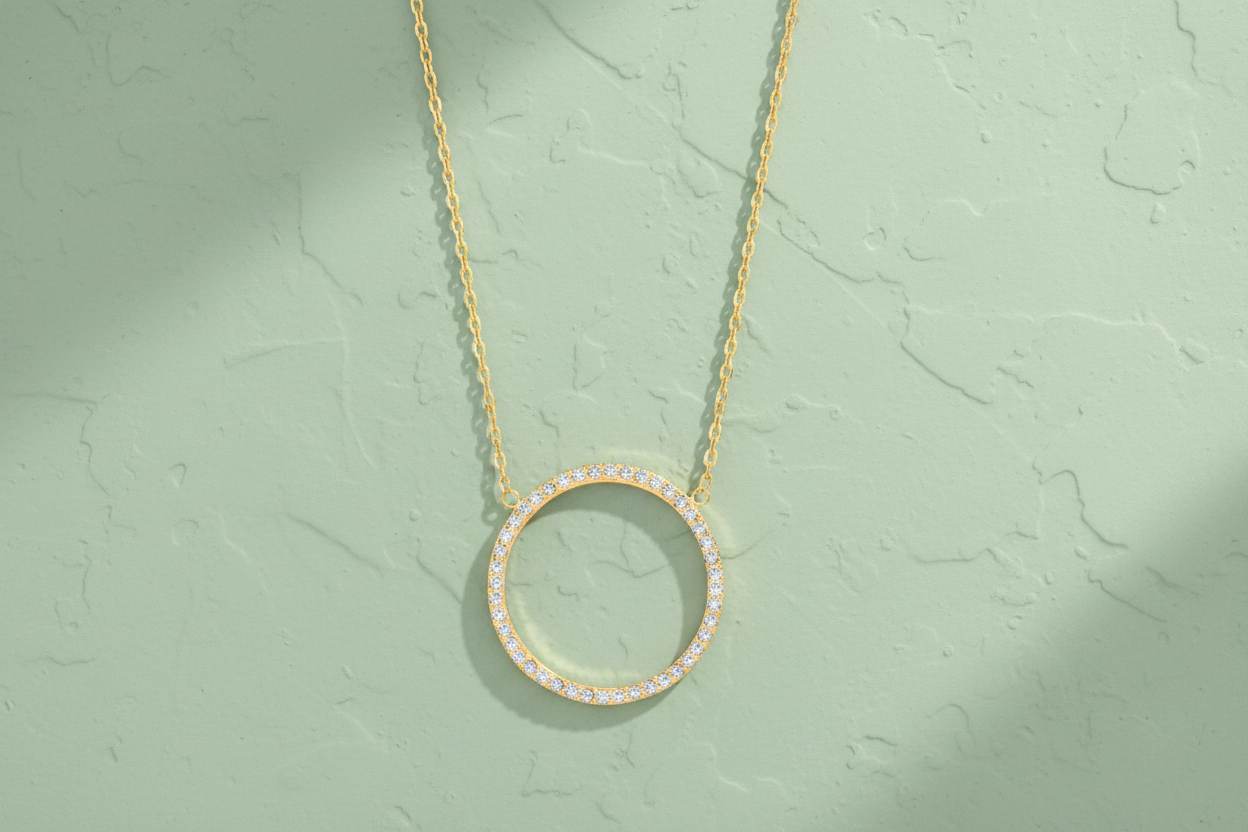 9ct Yellow Gold Circle of Life CZ Pendant Necklace on sage green textured background