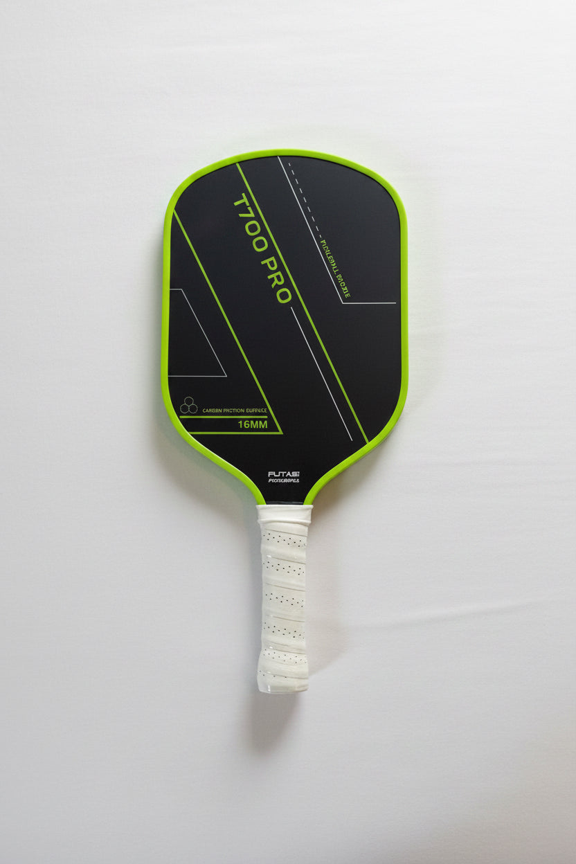 Pickleball paddle with green rim. Futasi T700