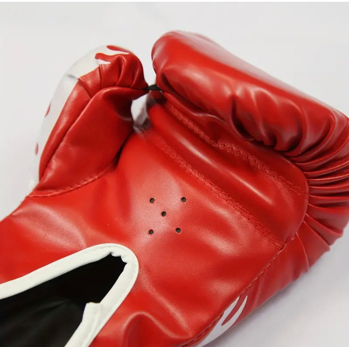 red boxing glove up close air vents