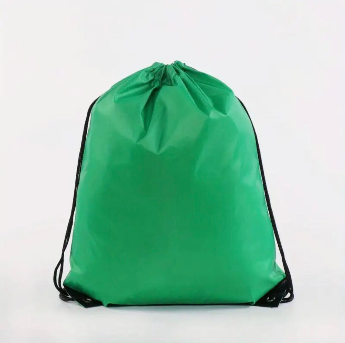 Green drawstring bag on a white background