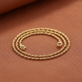 9ct Yellow Gold Singapore Anklet on warm terracotta textured background