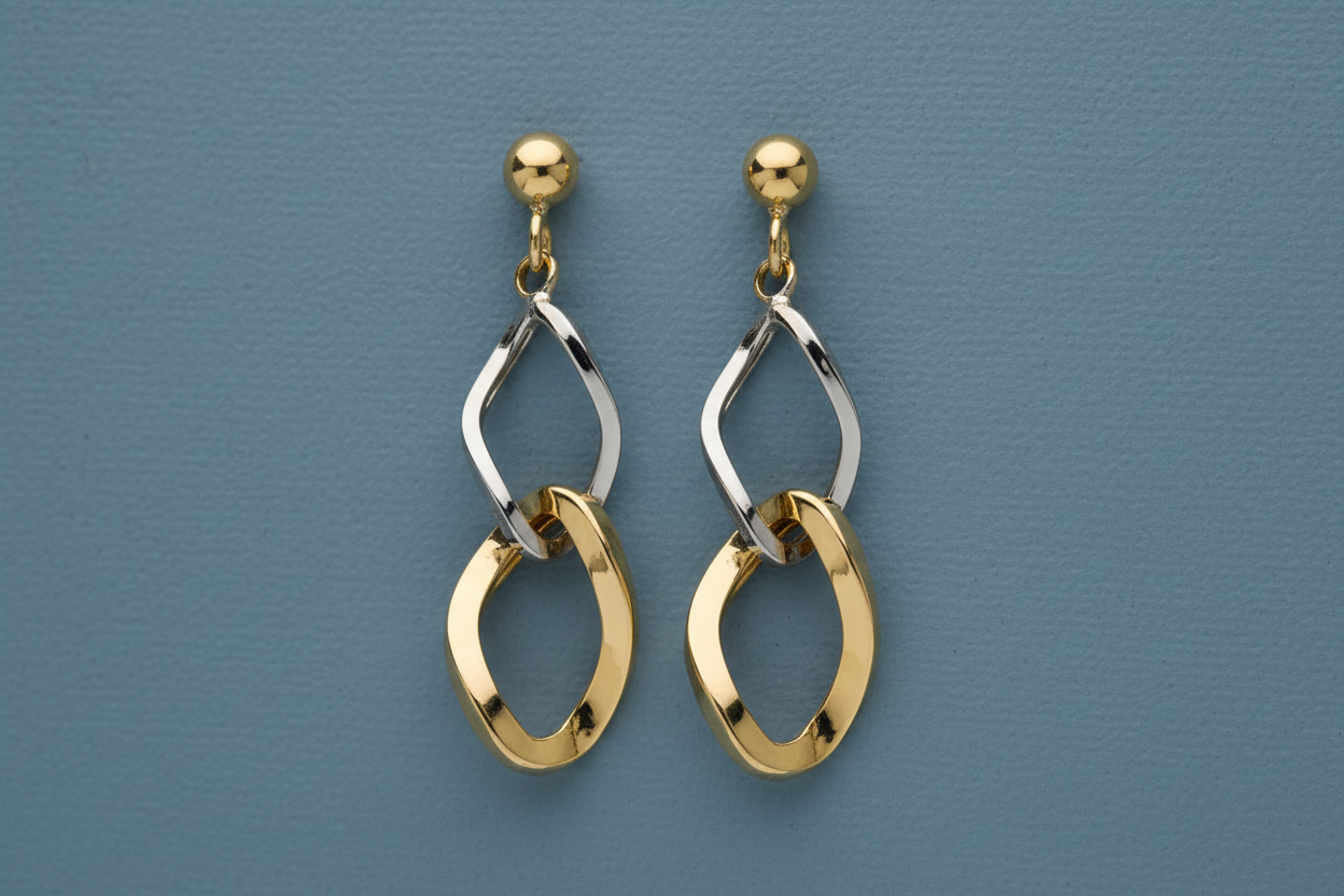 9ct Yellow & White Gold Fancy Drop Earrings on slate blue textured background