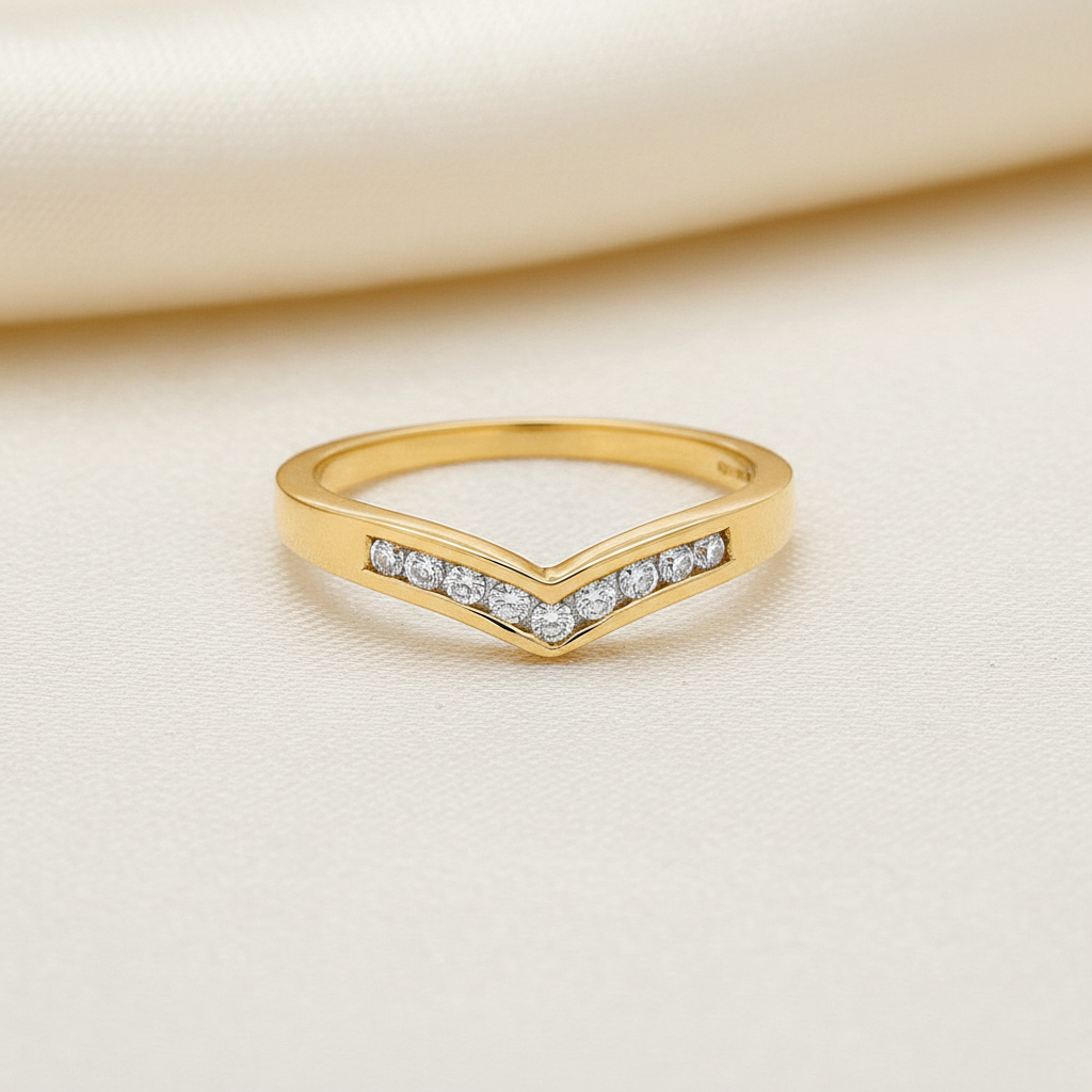 9ct Yellow Gold 0.15ct Diamond Wishbone Ring on soft ivory textured background