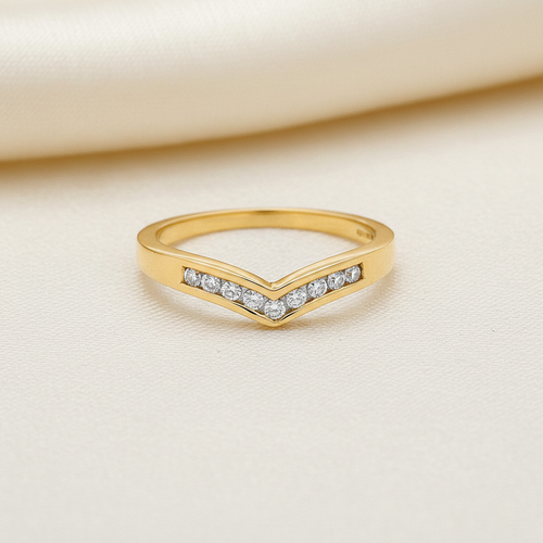 9ct Yellow Gold 0.15ct Diamond Wishbone Ring on soft ivory textured background