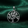 Silver Tree of Life CZ Pendant on textured forest green fabric background