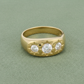 9ct Yellow Gold Gents 3 Stone CZ Ring on sage green textured background