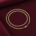 9ct Gold Hollow Rope Style Anklet on burgundy textured background
