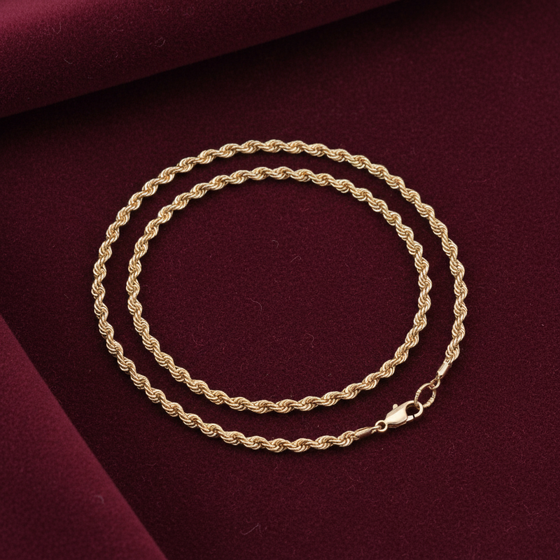 9ct Gold Hollow Rope Style Anklet on burgundy textured background