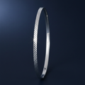 Silver Ladies Round Diamond Cut Bangle on navy blue background