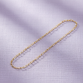 9ct Yellow Gold Rada Anklet on soft lavender textured background