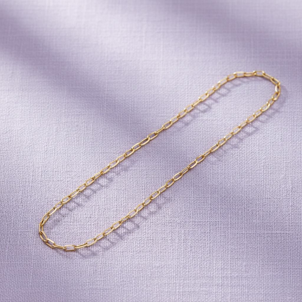 9ct Yellow Gold Rada Anklet on soft lavender textured background