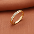 9ct Yellow Gold 0.25ct Diamond Eternity Ring 12 Stone on warm terracotta textured background