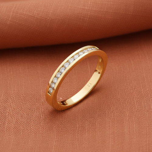 9ct Yellow Gold 0.25ct Diamond Eternity Ring 12 Stone on warm terracotta textured background