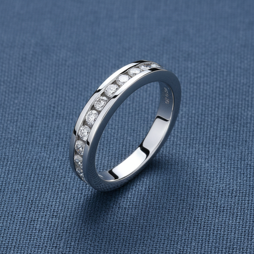 9ct White Gold 0.50ct Diamond Eternity Ring 12 Stone on slate blue textured background