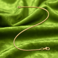 9ct Yellow Gold Box Chain Bracelet on lime green background