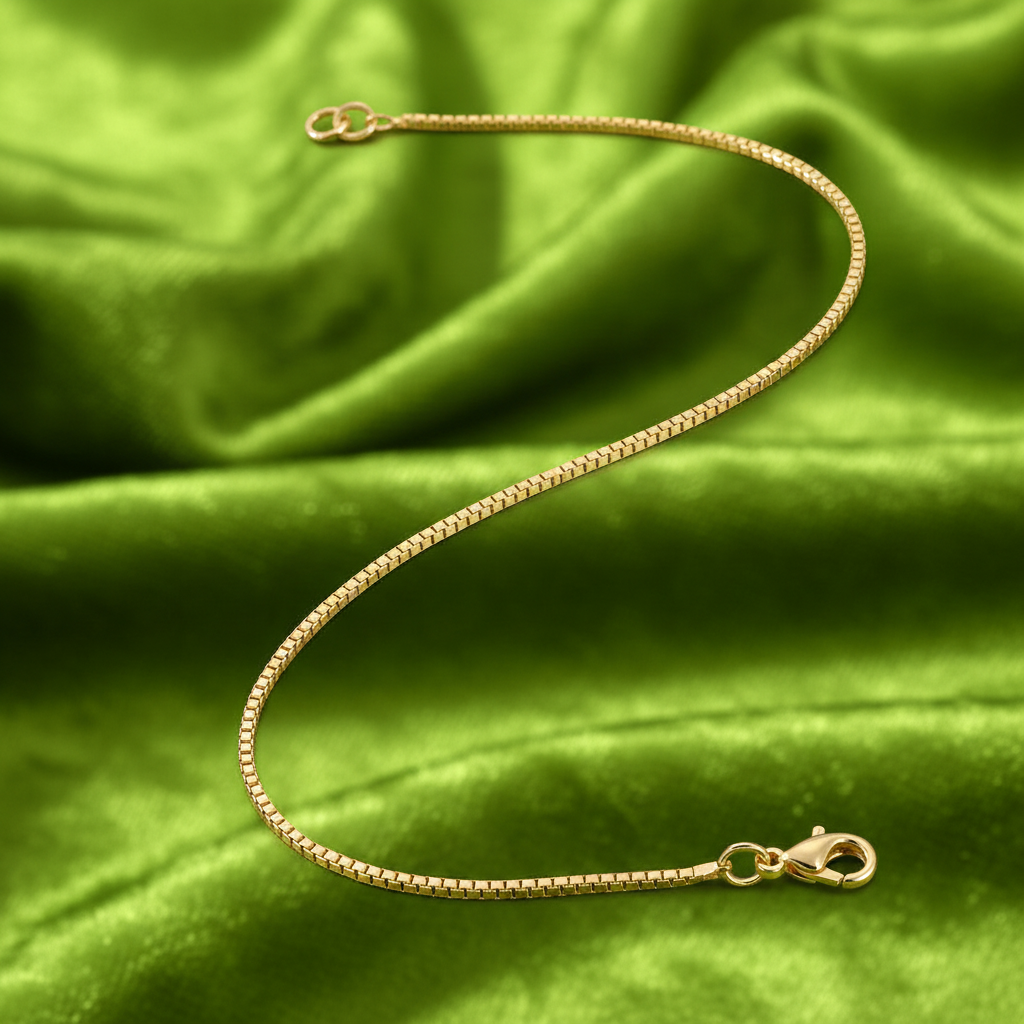 9ct Yellow Gold Box Chain Bracelet on lime green background