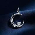 Silver Rhodium CZ Moon Pendant on midnight navy blue fabric background
