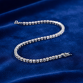 Silver CZ Tennis Bracelet on coloured velvet background