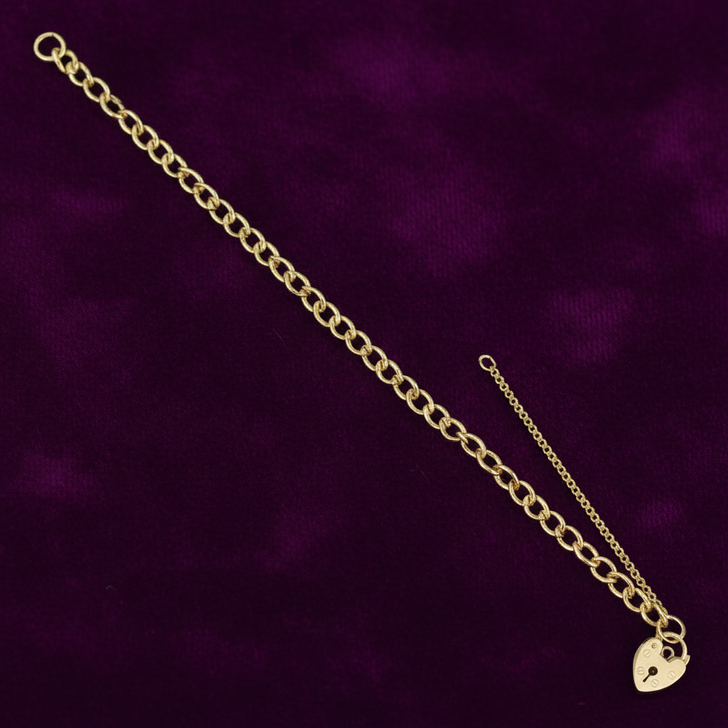 9ct Yellow Gold Open Curb & Padlock Charm Bracelet on purple velvet background