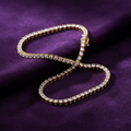 9ct Yellow Gold 3.5mm CZ Tennis Bracelet on purple velvet background