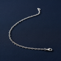 9ct White Gold Heart Shaped Anklet on midnight navy textured background