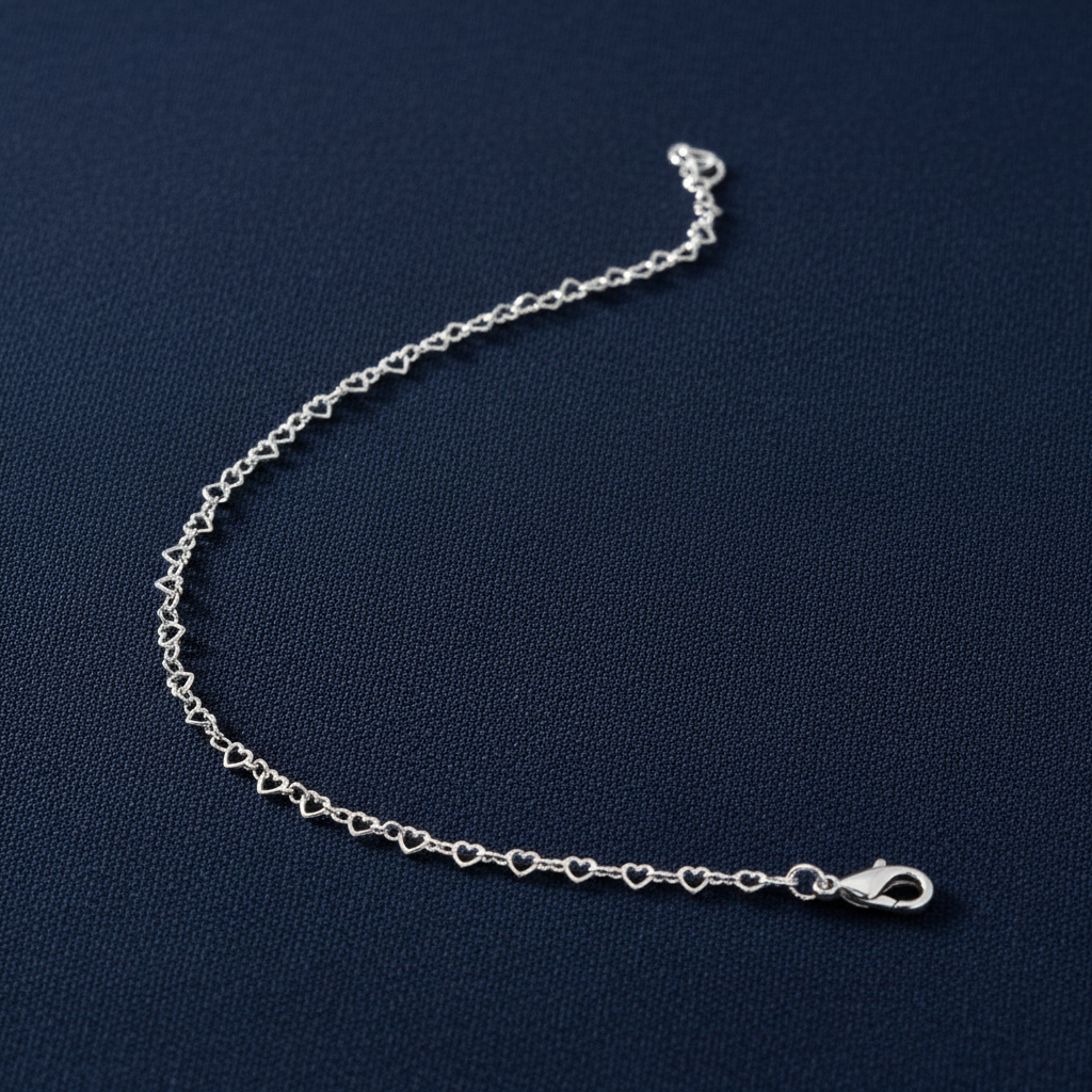 9ct White Gold Heart Shaped Anklet on midnight navy textured background