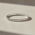 Silver Scale Pattern Mens ID Bracelet on light stone background