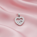 Silver Heart CZ Pendant on pink silk background