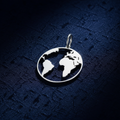 Silver Globe Pendant on textured navy blue fabric background