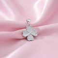 Silver Clover CZ Pendant on pink silk background