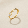 9ct Yellow Gold 0.10ct Diamond Ring on champagne cream textured background