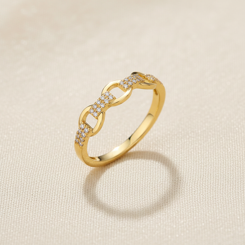 9ct Yellow Gold 0.10ct Diamond Ring on champagne cream textured background