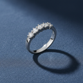 9ct White Gold 0.50ct 5 Stone Diamond Eternity Ring on slate blue textured background
