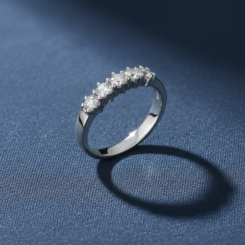 9ct White Gold 0.50ct 5 Stone Diamond Eternity Ring on slate blue textured background