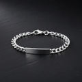 Silver Mens Flat Open Curb ID Bracelet with lobster clasp on dark background