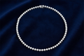 Silver rhodium plated full CZ tennis necklet on deep navy velvet background