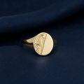 9ct Yellow Gold Engraved Oval Signet Ring on midnight navy textured background