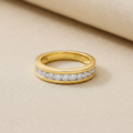 9ct Yellow Gold 0.75ct Diamond Eternity Ring 12 Stone on champagne cream textured background