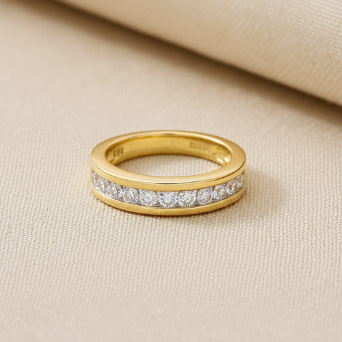 9ct Yellow Gold 0.75ct Diamond Eternity Ring 12 Stone on champagne cream textured background