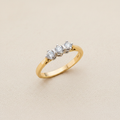 9ct Yellow Gold 0.33ct Diamond Trilogy Ring on champagne cream textured background