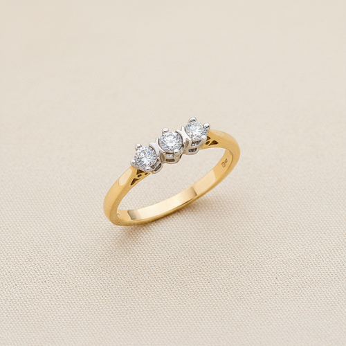 9ct Yellow Gold 0.33ct Diamond Trilogy Ring on champagne cream textured background
