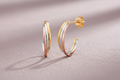 9ct Yellow, White & Rose Gold Russian Drop Earrings on mauve textured background
