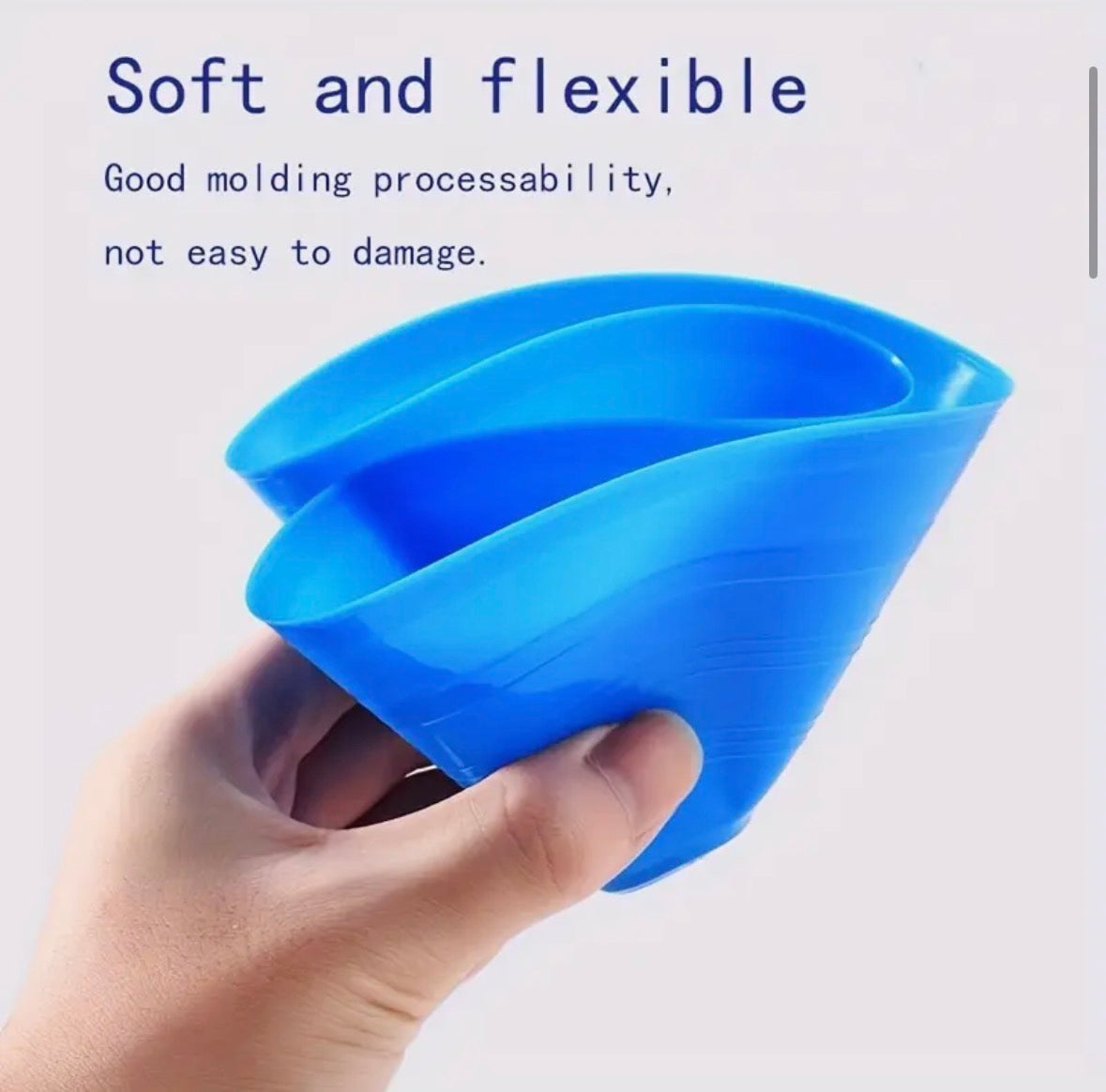 Blue Football / Soccer marker  held by a hand with text about its softness and flexibility