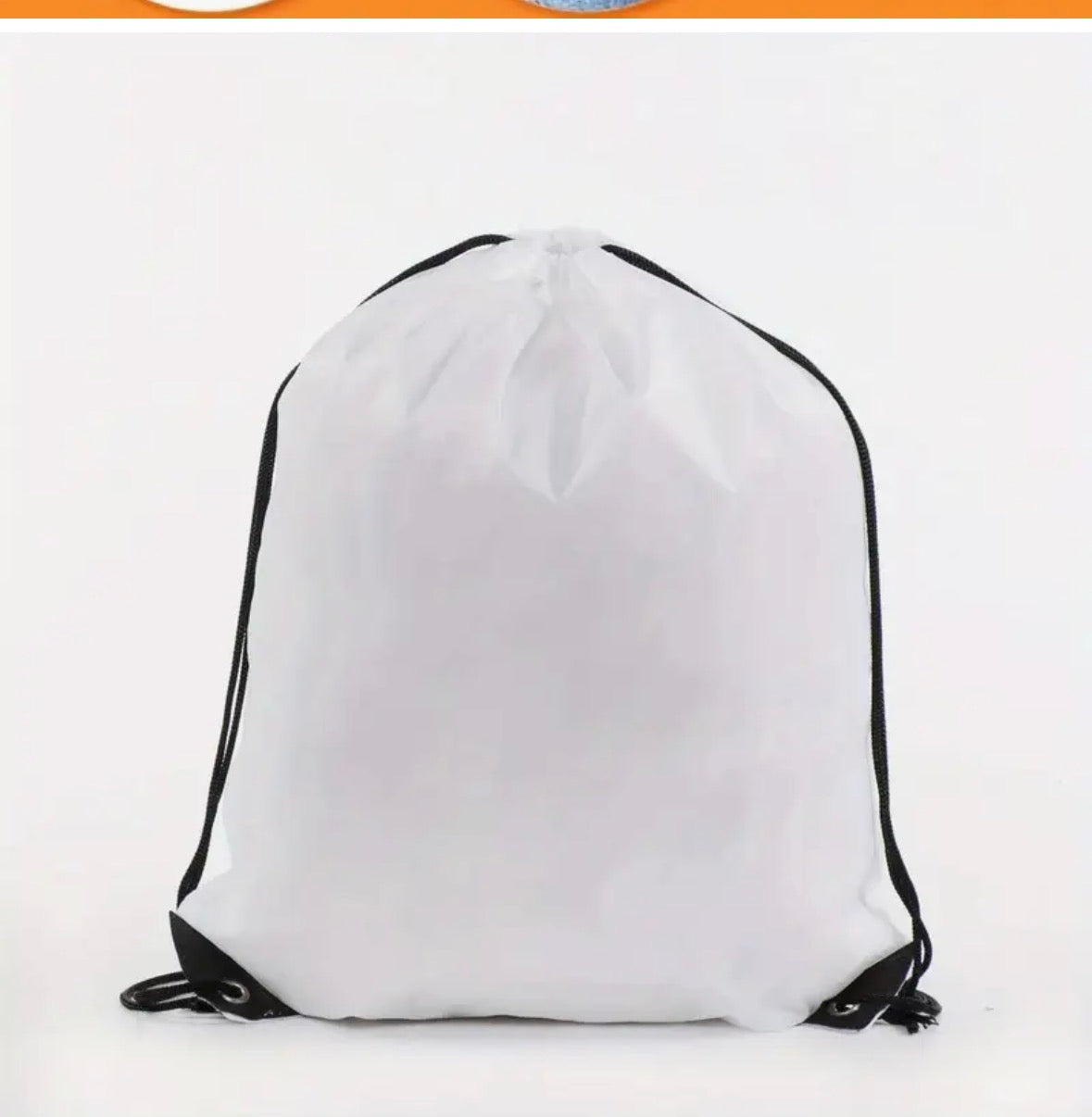 White drawstring bag with black strings on a white background